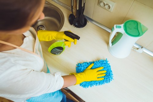 Staff using proper protective measures during carpet cleaning work