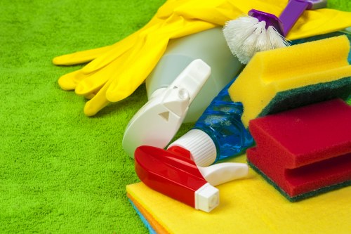 Technician treating a fabric sofa during upholstery cleaning